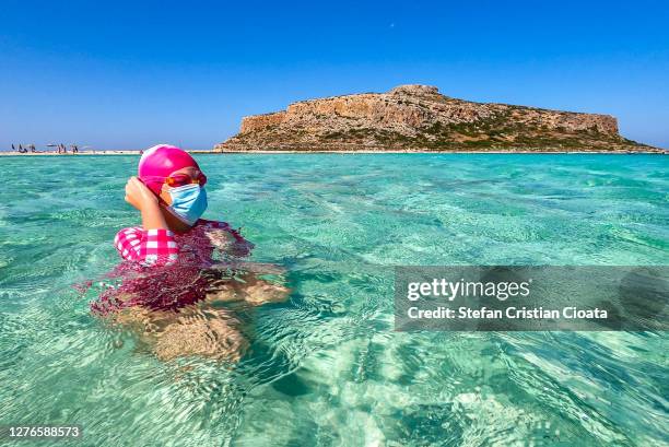 girl at balos beach crete - balonnen stock-fotos und bilder