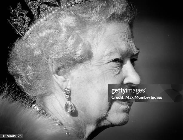 Queen Elizabeth II travels down The Mall, from Buckingham Palace to the Palace of Westminster, in the horse drawn Australian State Coach to attend...