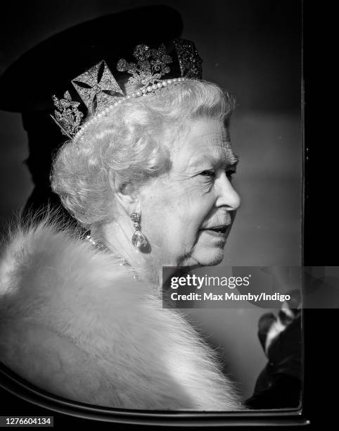 Queen Elizabeth II travels down The Mall, from Buckingham Palace to the Palace of Westminster, in the horse drawn Australian State Coach to attend...