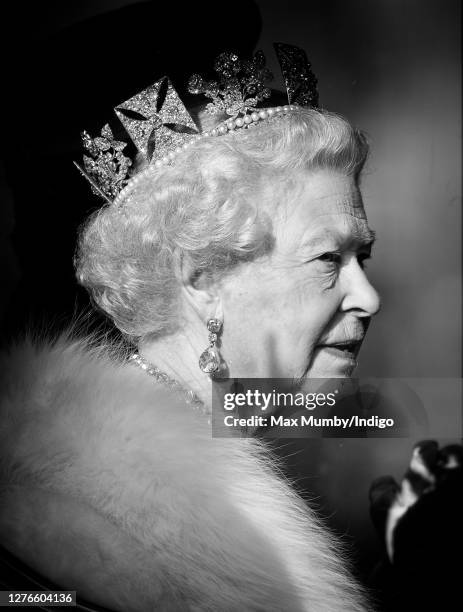 Queen Elizabeth II travels down The Mall, from Buckingham Palace to the Palace of Westminster, in the horse drawn Australian State Coach to attend...