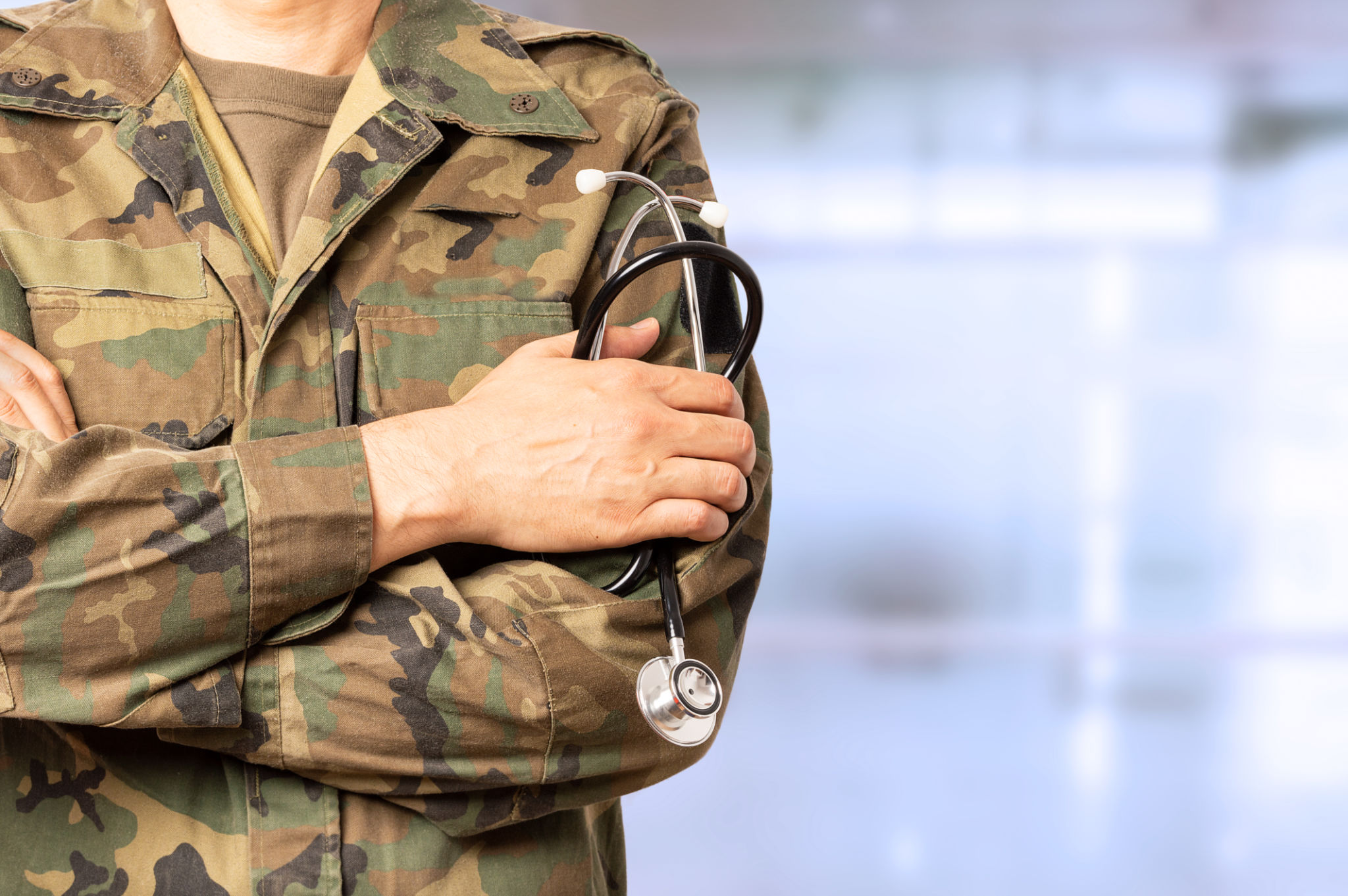 military doctor with crossed arms at a hospital military doctor with crossed arms at a hospital