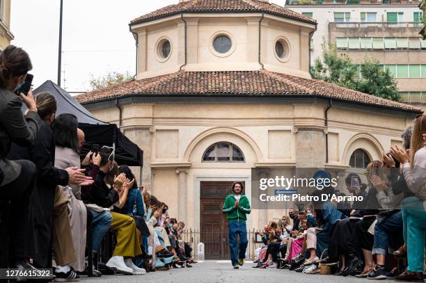 Designer Marco Rambaldi ackowledges the applause of the audience at the Marco Rambaldi fashion show during the Milan Women's Fashion Week on...