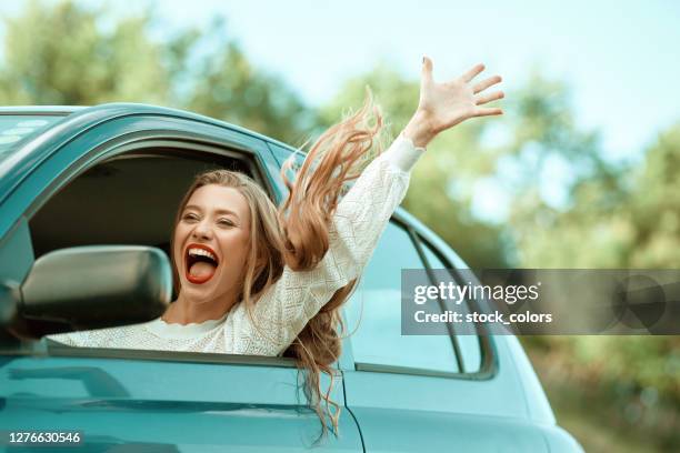 blond woman feeling free shouting of happiness - open romania imagens e fotografias de stock