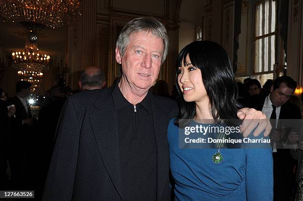 Regis Varnier and Linh-Dan Pham pose after she receives the medal "Chevalier des Arts et des lettres" at Ministere de la Culture on April 5, 2011 in...