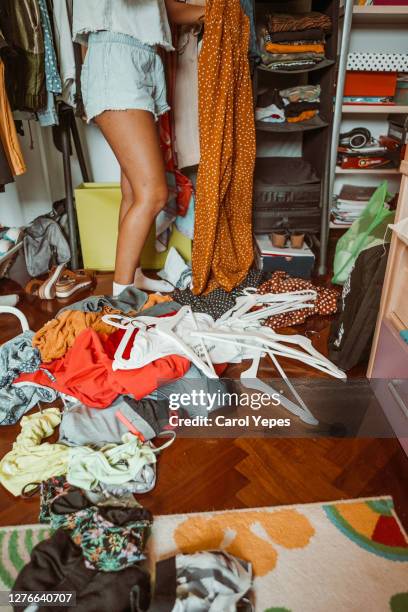 low section teenager tidying the room - amontoar imagens e fotografias de stock