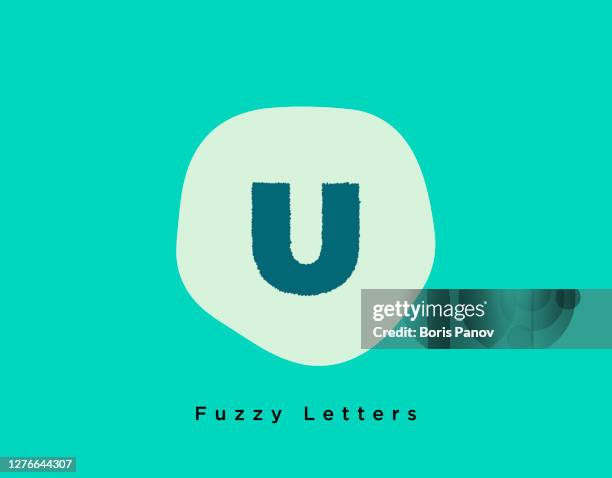 fuzzy bold letter u on a oddly shaped light blue background - letter u stock illustrations