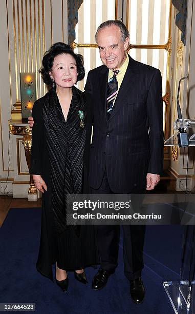 Yoon Jung-Hee and French Minister of Culture Frederic Mitterrand pose after she receives the medal "Chevalier des Arts et des lettres" at Ministere...