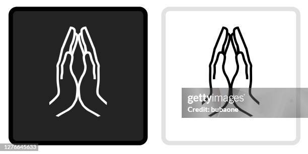 hands together icon on black button with white rollover - praying hands stock illustrations