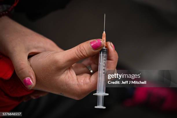 Drug users inject, inside of a Safe Consumption van set up by Peter Krykant on September 25, 2020 in Glasgow, Scotland. Peter a recovering heroin...