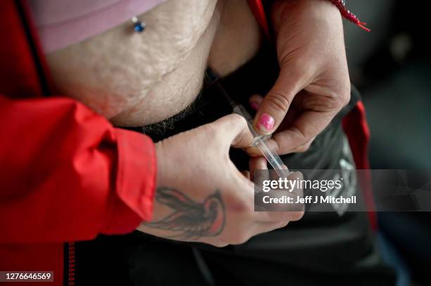 Drug users injects, inside of a Safe Consumption van set up by Peter Krykant on September 25, 2020 in Glasgow, Scotland. Peter a recovering heroin...