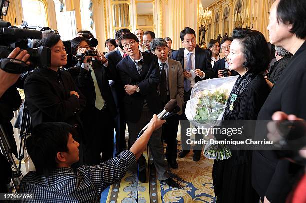 Yoon Jung-Hee her Husband Kun-woo Paik meet press after she receives the medal "Chevalier des Arts et lettres" at Ministere de la Culture on April 5,...