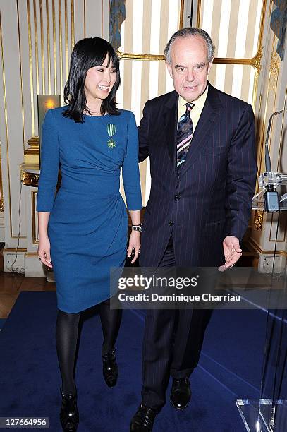 Linh-Dan Pham and French Minister of Culture Frederic Mitterrand pose after she receives the medal "Chevalier des Arts et des lettres" at Ministere...