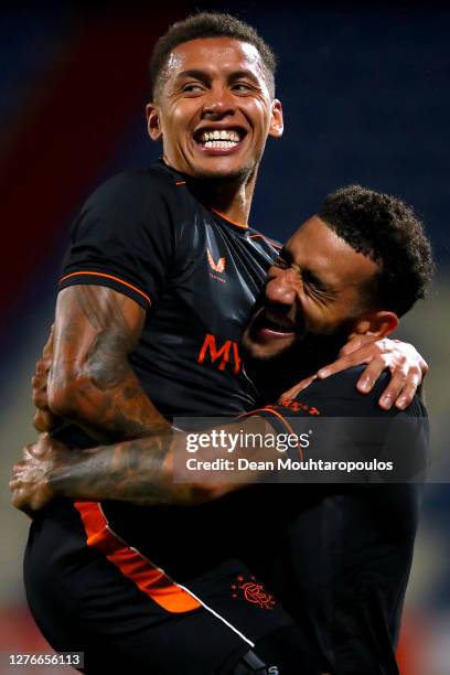 Connor Goldson of Rangers celebrates scoring his teams fourth goal of the game with team mate James Tavernier during the UEFA Europa League third...