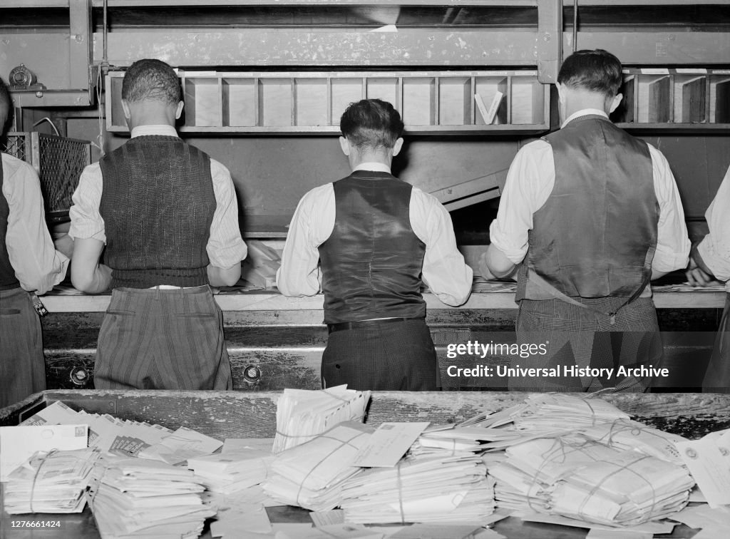 Workers sorting mail at Main Post Office, Washington, D.C., USA, Arthur Rothstein, U.S. Office of War Information, 1938