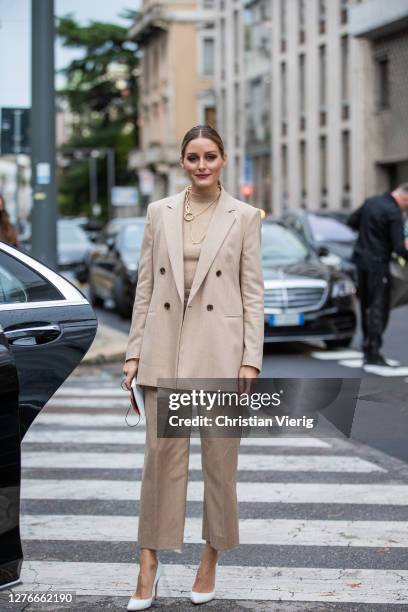 Olivia Palermo seen wearing beige turtleneck, blazer and pants, white heels, necklace outside Boss during the Milan Women's Fashion Week on September...