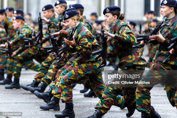 Princess Elisabeth of Belgium and her platoon salute and present arms in formation during the Blue Beret Parade at the Royal Military Academy at the...