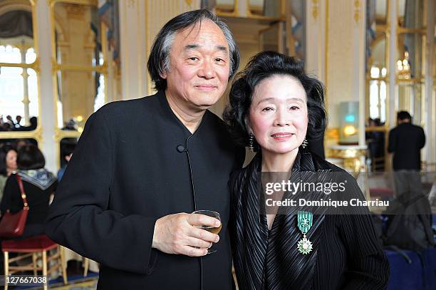 Yoon Jung-Hee pose with her Husband Kun-woo Paik after she receives the medal "Chevalier des Arts et lettres" at Ministere de la Culture on April 5,...