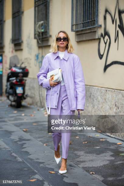 Candela Novembre seen wearing pink pants and jacket, white bag outside Boss during the Milan Women's Fashion Week on September 25, 2020 in Milan,...