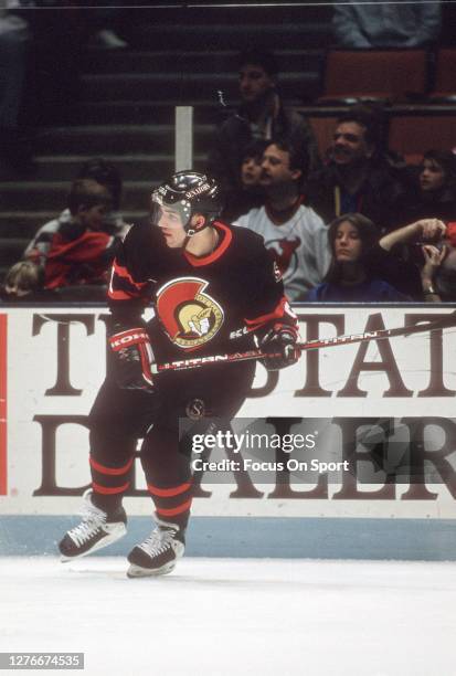 Alexandre Daigle of the Ottawa Senators skates against the New Jersey Devils during an NHL Hockey game circa 1994 at the Brendan Byrne Arena in East...