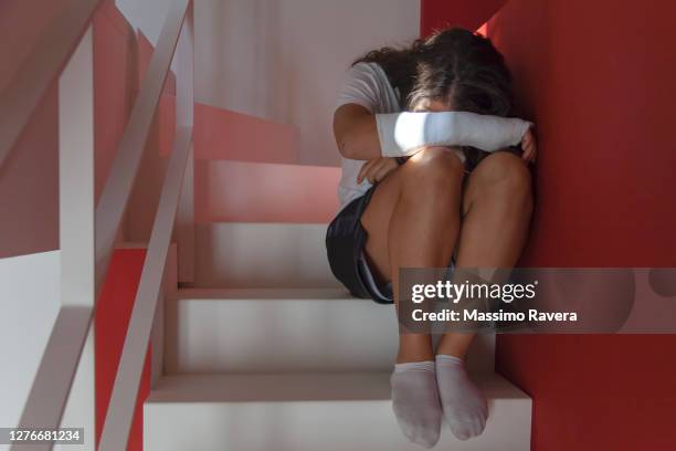 teenage girl with broken right arm in plaster - children violence stock pictures, royalty-free photos & images