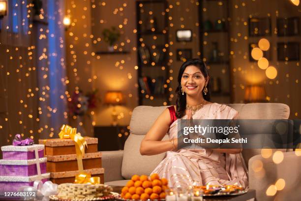 young woman diwali celebrate - stock photo - namaste greeting stock pictures, royalty-free photos & images