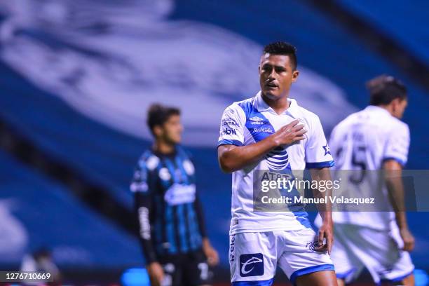 Osvaldo Martínez of Puebla celebrates the first scored goal of Puebla during the 12th round match between Puebla v Queretaro as part of the Torneo...