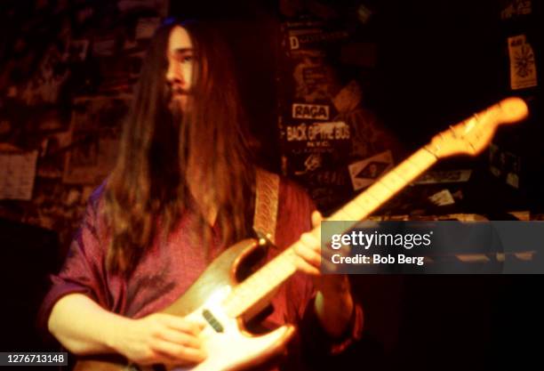 Guitarist Rob Baker of the Canadian rock group The Tragically Hip plays his guitar on stage during a concert circa February, 1992 in New York, New...