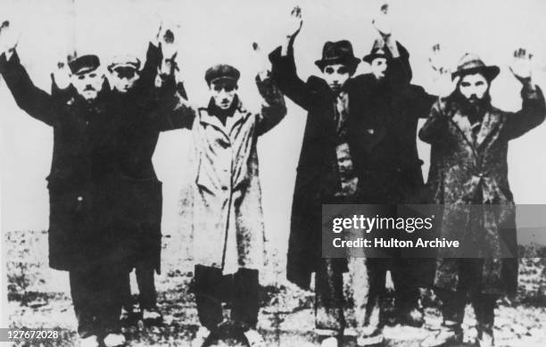 Six Jewish men under arrest in Nazi-occupied Poland, circa 1941.