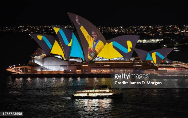 Moving video images of Cathy Freeman projected onto the sails of the Sydney Opera House on September 25, 2020 in Sydney, Australia. The projection...