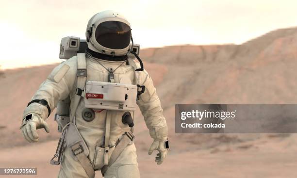 astronaut walking on mars - spacesuit stock pictures, royalty-free photos & images