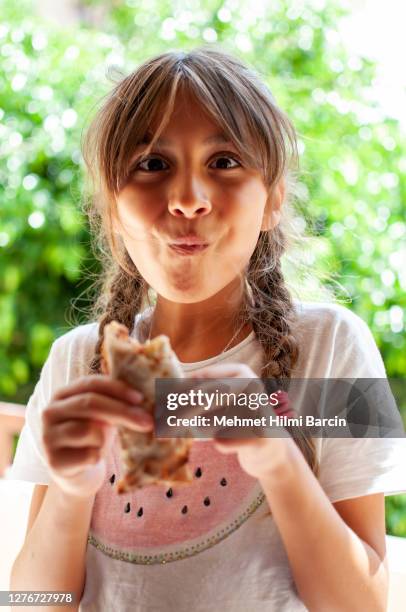 little girl eating traditional raw turkish pizza (lahmacun) - raw fajita beef stock pictures, royalty-free photos & images