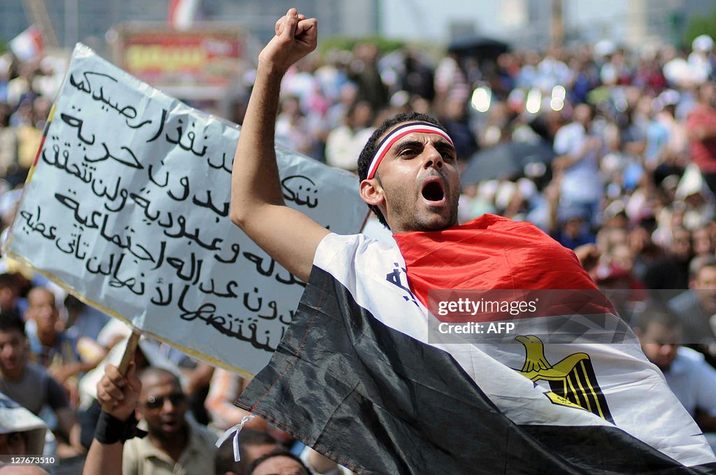 An Egyptian protester wrapped with his n