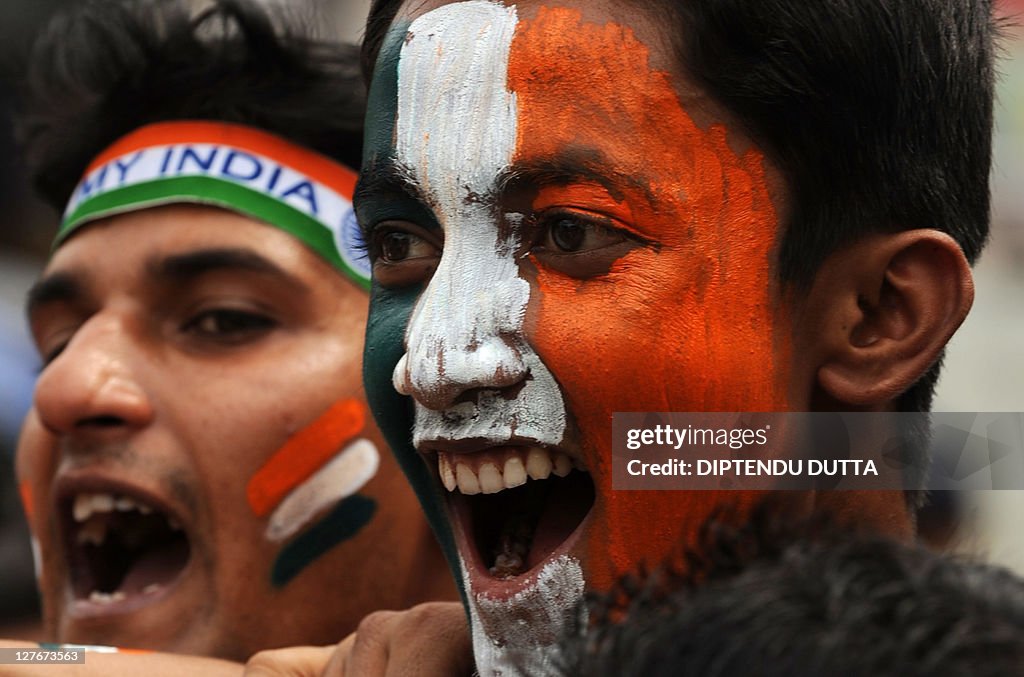 Indian cricket fans cheer in support of