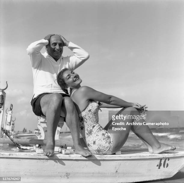 American-born Greek opera singer, Maria Callas with her first husband, industrialist Giovanni Battista Meneghini on Venice Lido beach, Venice, 1950.