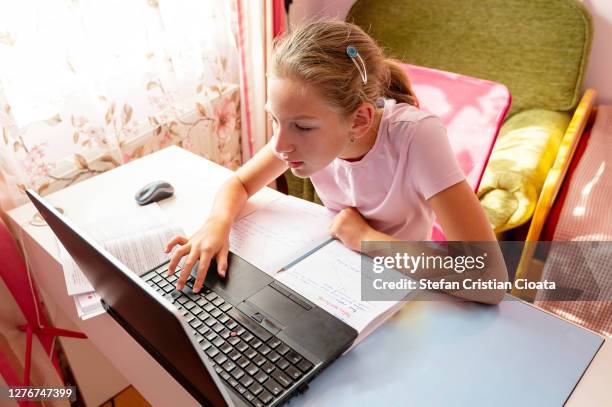 12 years old girl at home schooling - 12 13 years old girls stock-fotos und bilder