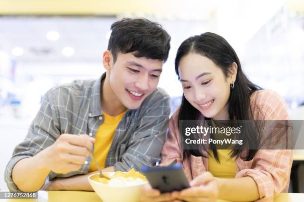 couple eat mango shaved ice - mango shaved ice stock pictures, royalty-free photos & images