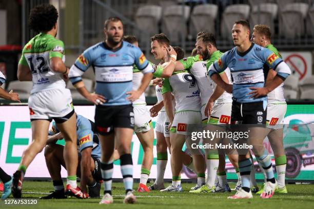 Sam Williams of the Raiders celebrates with team mates after scoring a try during the round 20 NRL match between the Cronulla Sharks and the Canberra...