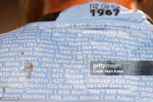 Former Sharks players names are seen on the back of a players jersey during the round 20 NRL match between the Cronulla Sharks and the Canberra...