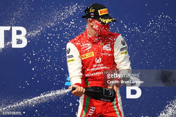 Race winner Mick Schumacher of Germany and Prema Racing celebrates on the podium during the Formula 2 Championship Feature Race at Sochi Autodrom on...