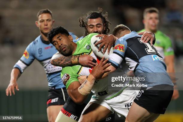 Iosia Soliola of the Raiders is tackled during the round 20 NRL match between the Cronulla Sharks and the Canberra Raiders at Netstrata Jubilee...