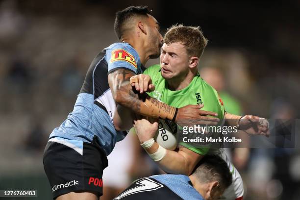 Hudson Young of the Raiders is tackled during the round 20 NRL match between the Cronulla Sharks and the Canberra Raiders at Netstrata Jubilee...