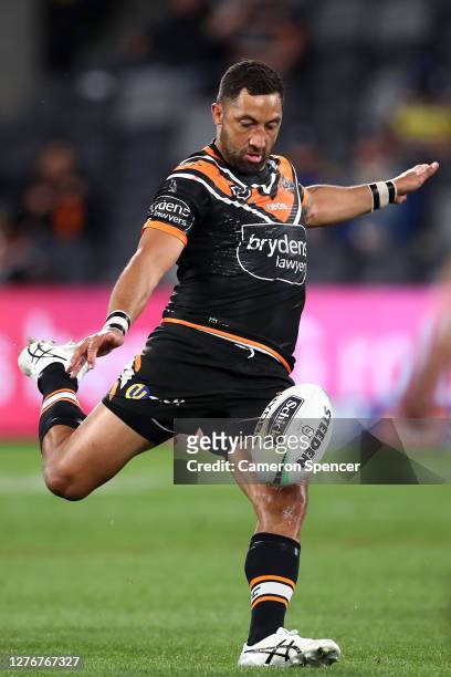Benji Marshall of the Tigers kicks during the round 20 NRL match between the Wests Tigers and the Parramatta Eels at Bankwest Stadium on September...