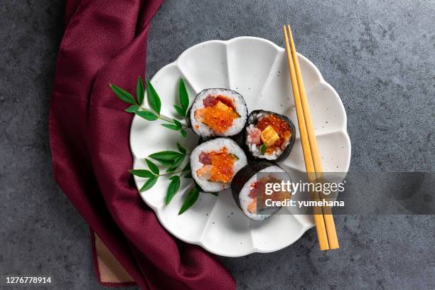 seafood rolled sushi - ikura stock pictures, royalty-free photos & images