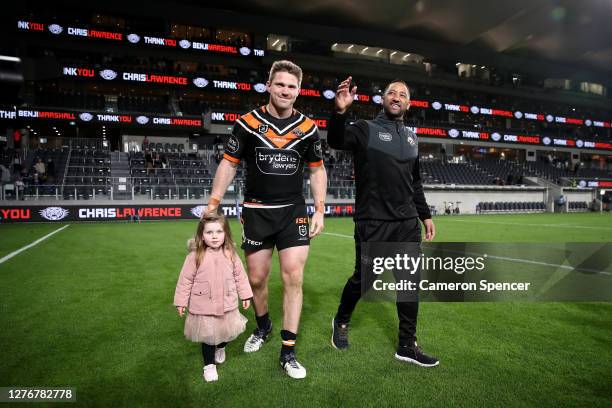 Benji Marshall of the Tigers and Chris Lawrence of the Tigers thank fans after playing their last game for the Tigers following the round 20 NRL...