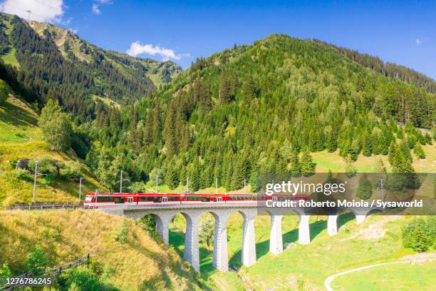 glacier express train on tujetsch viaduct, switzerland - switzerland train stock pictures, royalty-free photos & images