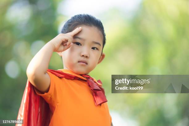 supergirl saluting - child saluting stock pictures, royalty-free photos & images