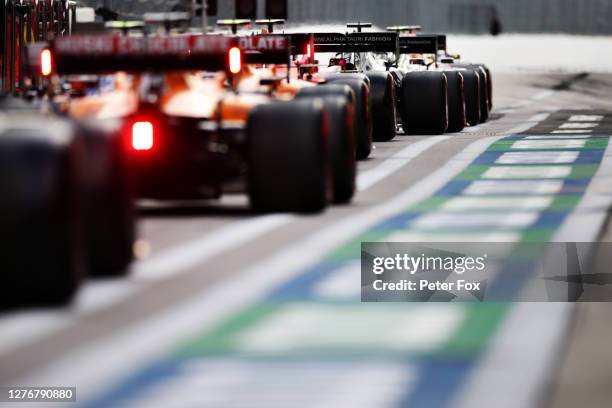 Daniil Kvyat of Russia driving the Scuderia AlphaTauri AT01 Honda is pictured in a queue of cars waiting to leave the pitlane during qualifying ahead...