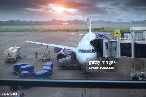 passenger plane standing at dabolim airport, goa, india - airfield stock pictures, royalty-free photos & images