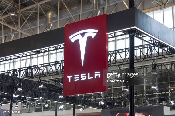 Company logo hangs at the Tesla stand during 2020 Beijing International Automotive Exhibition at China International Exhibition Center on September...