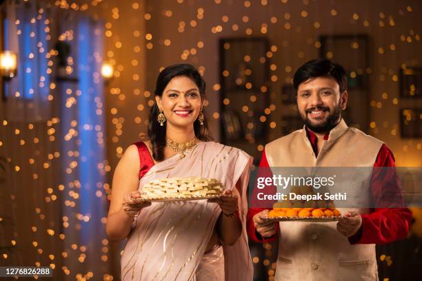 couple diwali celebrate - stock photo - diwali sweets stock pictures, royalty-free photos & images